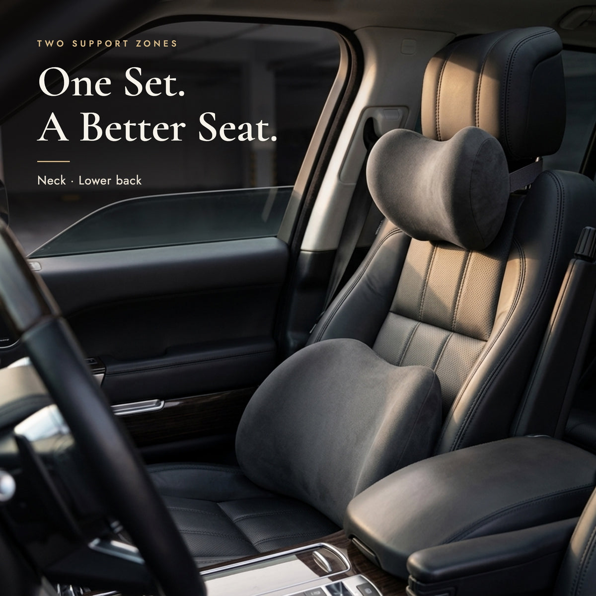 Neck pillow on the headrest and lumbar pillow on a black leather car seat