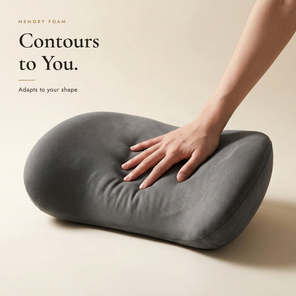 Hand pressing into the memory foam lumbar pillow