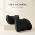 Black neck pillow and lumbar pillow on an ivory background