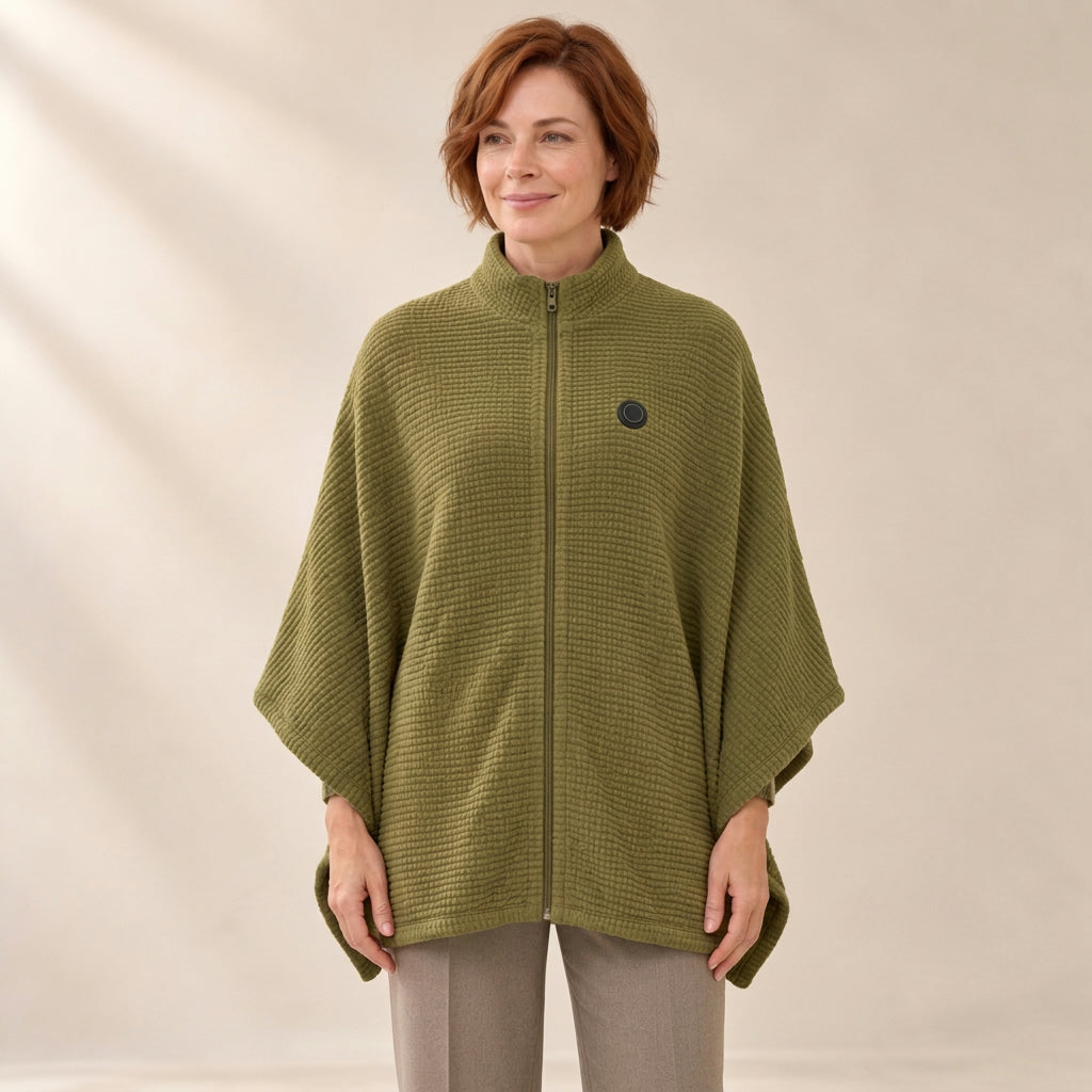 Woman wearing the Olive Green heated zip-up knit poncho, zipped to the stand collar