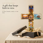 Story of Jesus cross beside an open charcoal gift box with cream tissue and ribbon